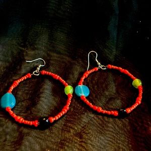 2” beaded earrings with fish hooks. Red/orange